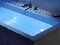 A sink with water and lights