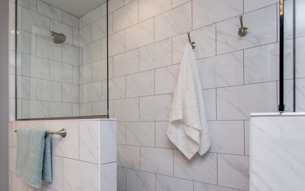 A white bathroom and shower area