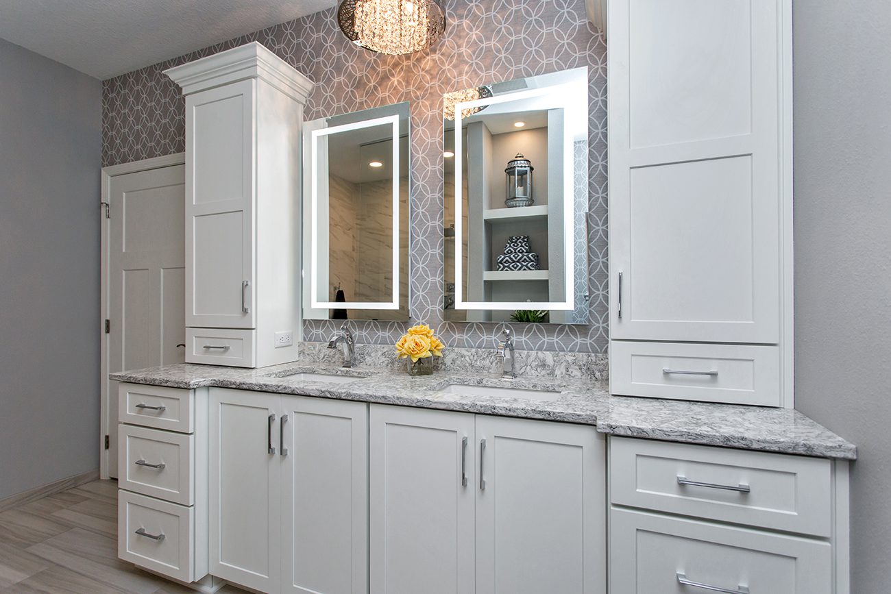 A white colored bathroom with patterned walls