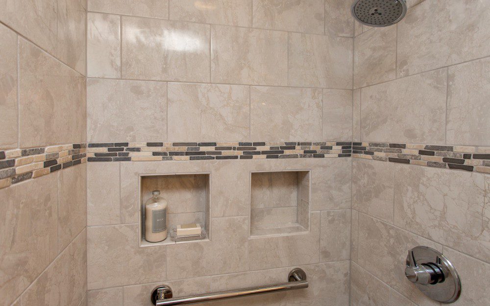 A beige walled shower area