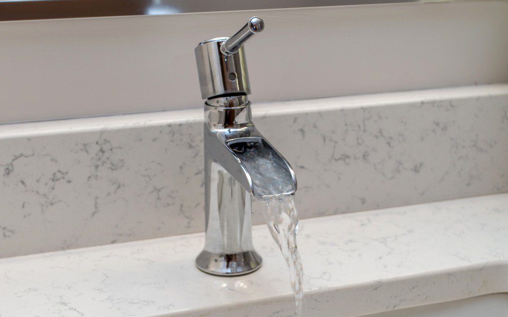 A faucet with running water