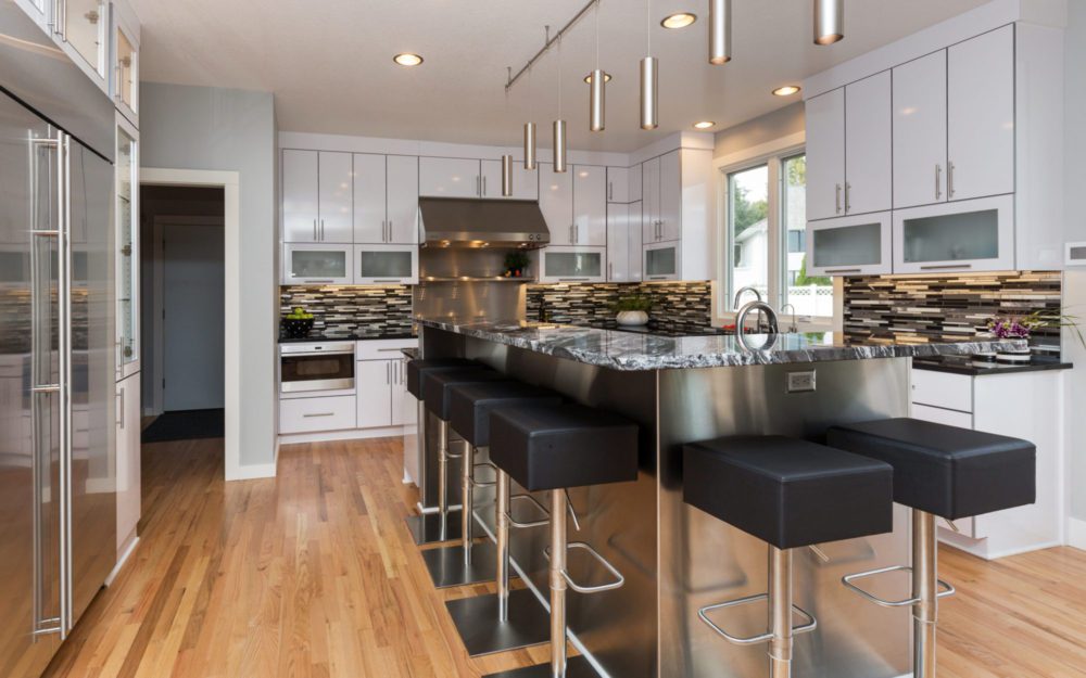 A modern kitchen with black and white designs 